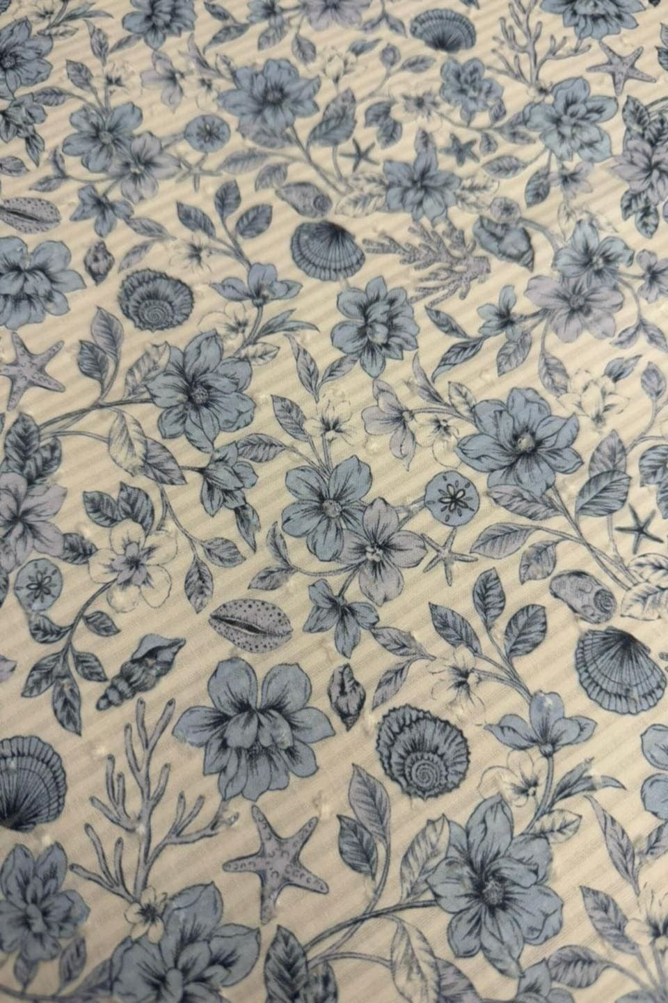 Blue floral pattern on a beige background