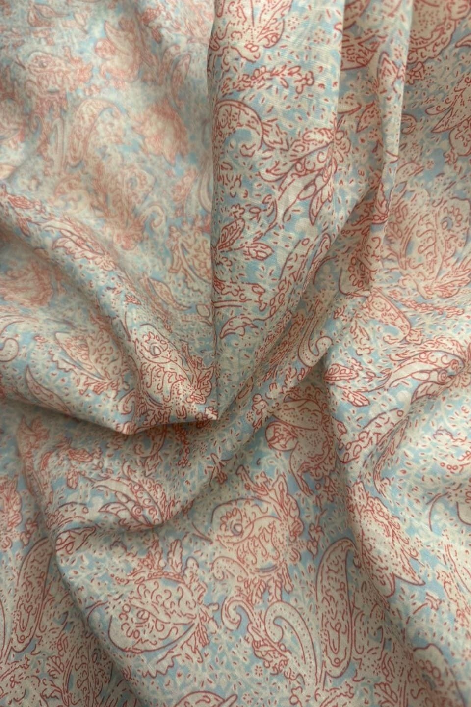Close-up of patterned fabric with red and blue design