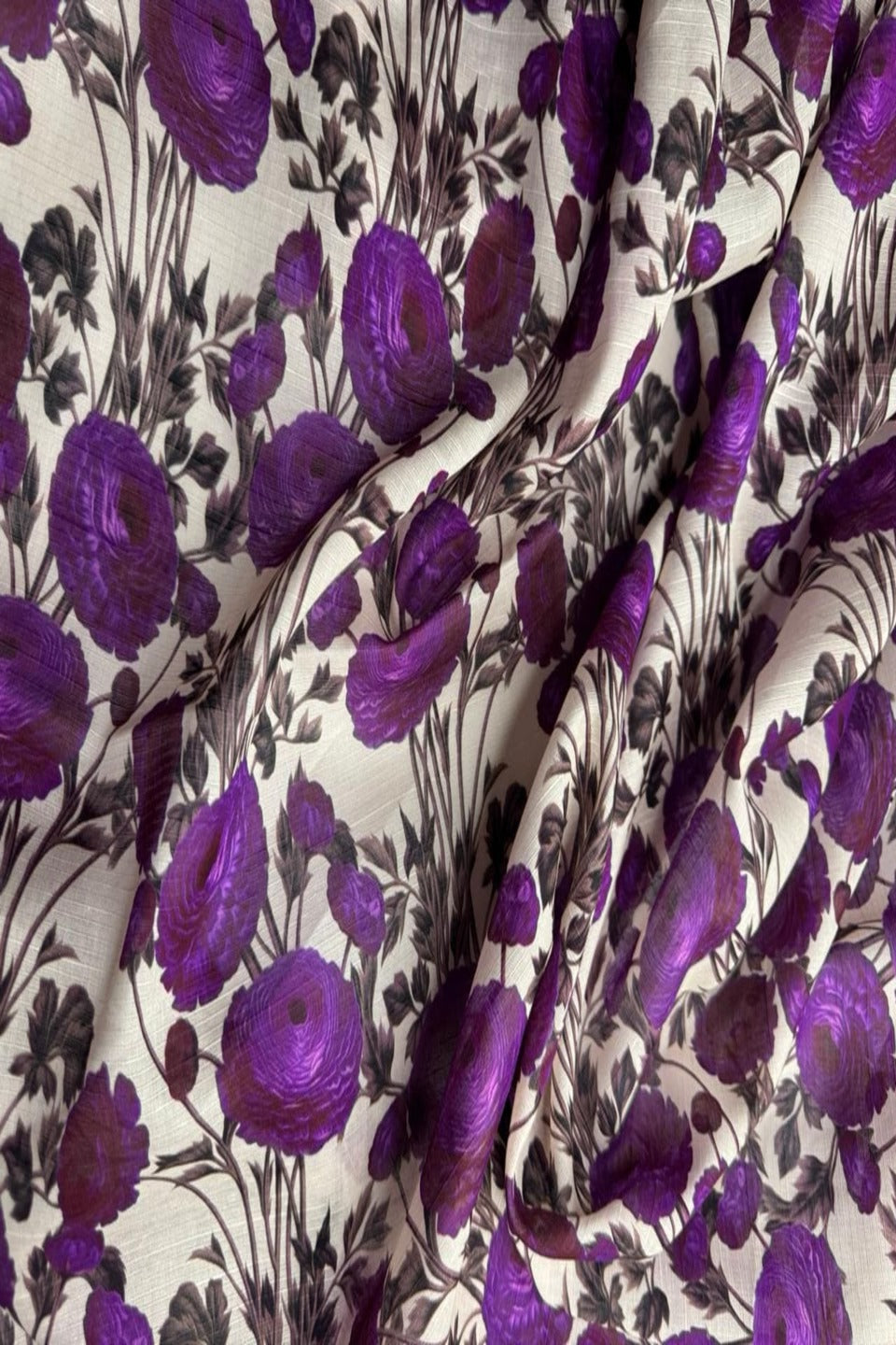 Floral fabric with purple flowers on a white background