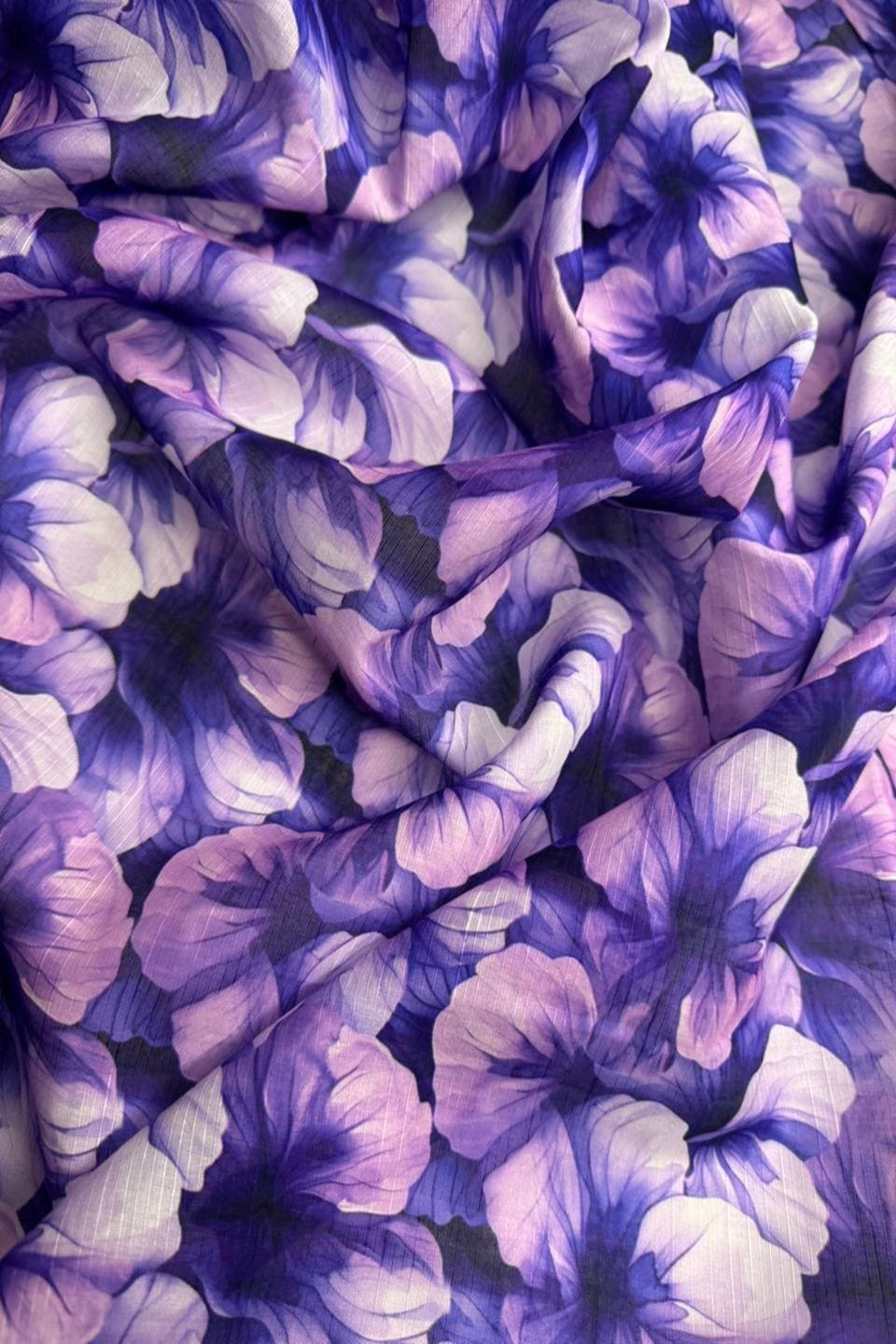 Close-up of purple and white floral fabric pattern