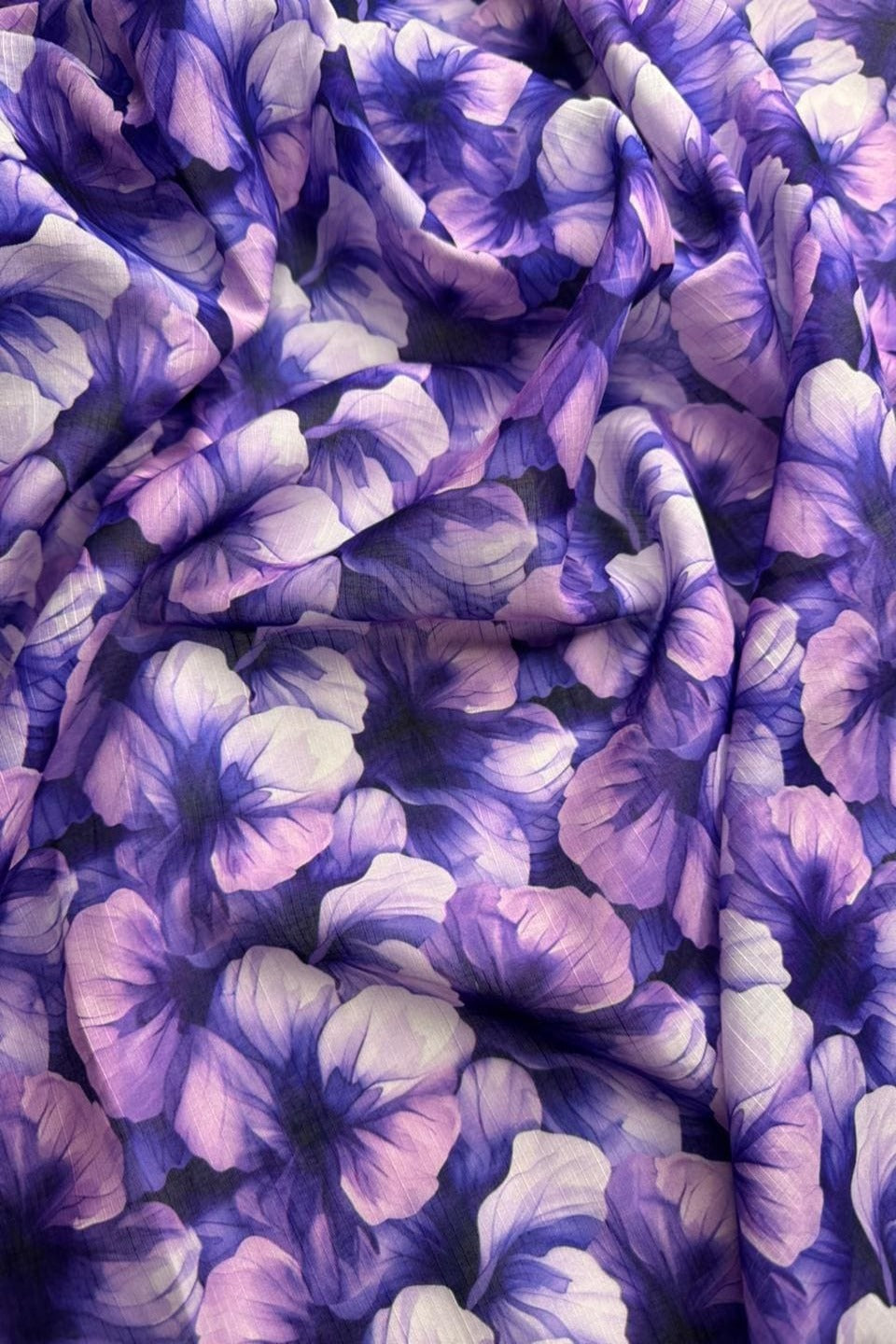 Close-up of a purple and white floral fabric pattern