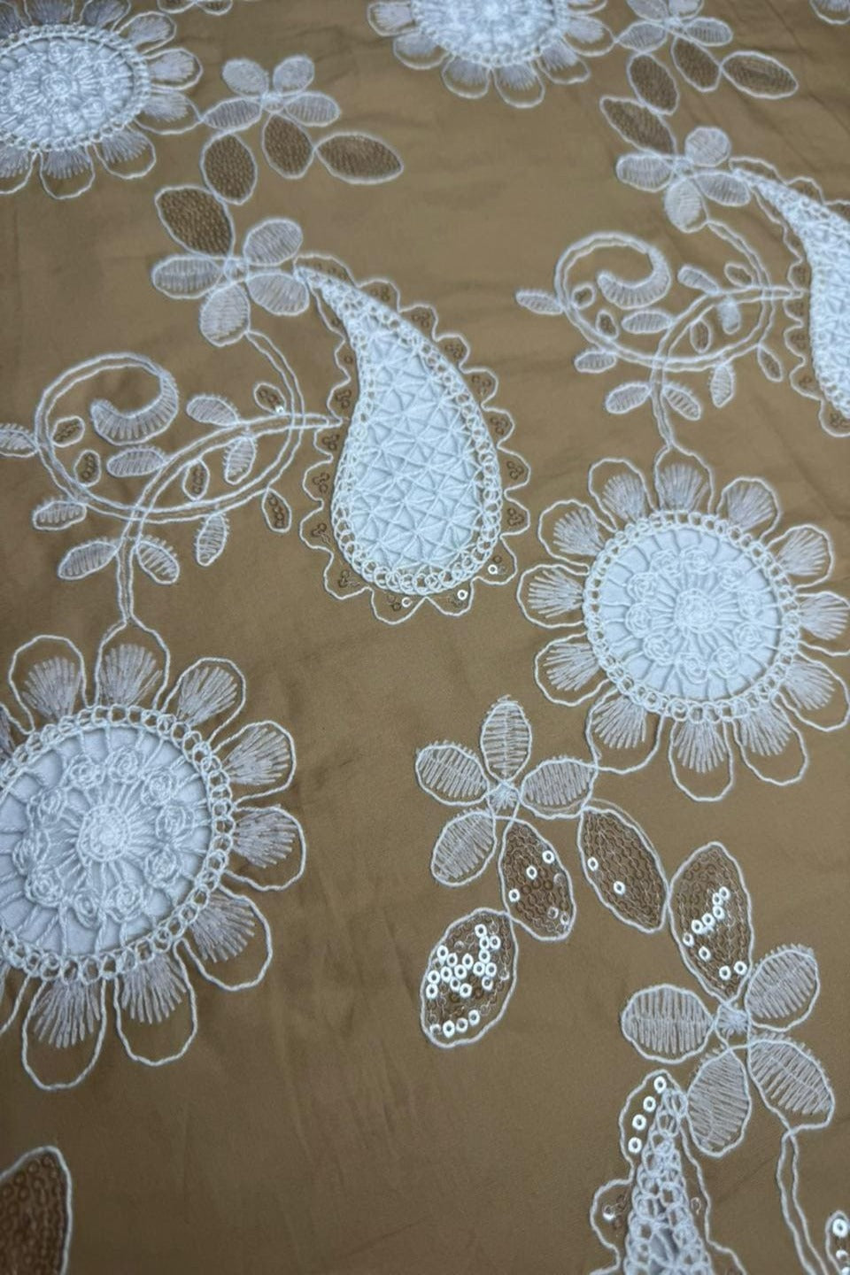 Brown fabric with white floral lace embroidery