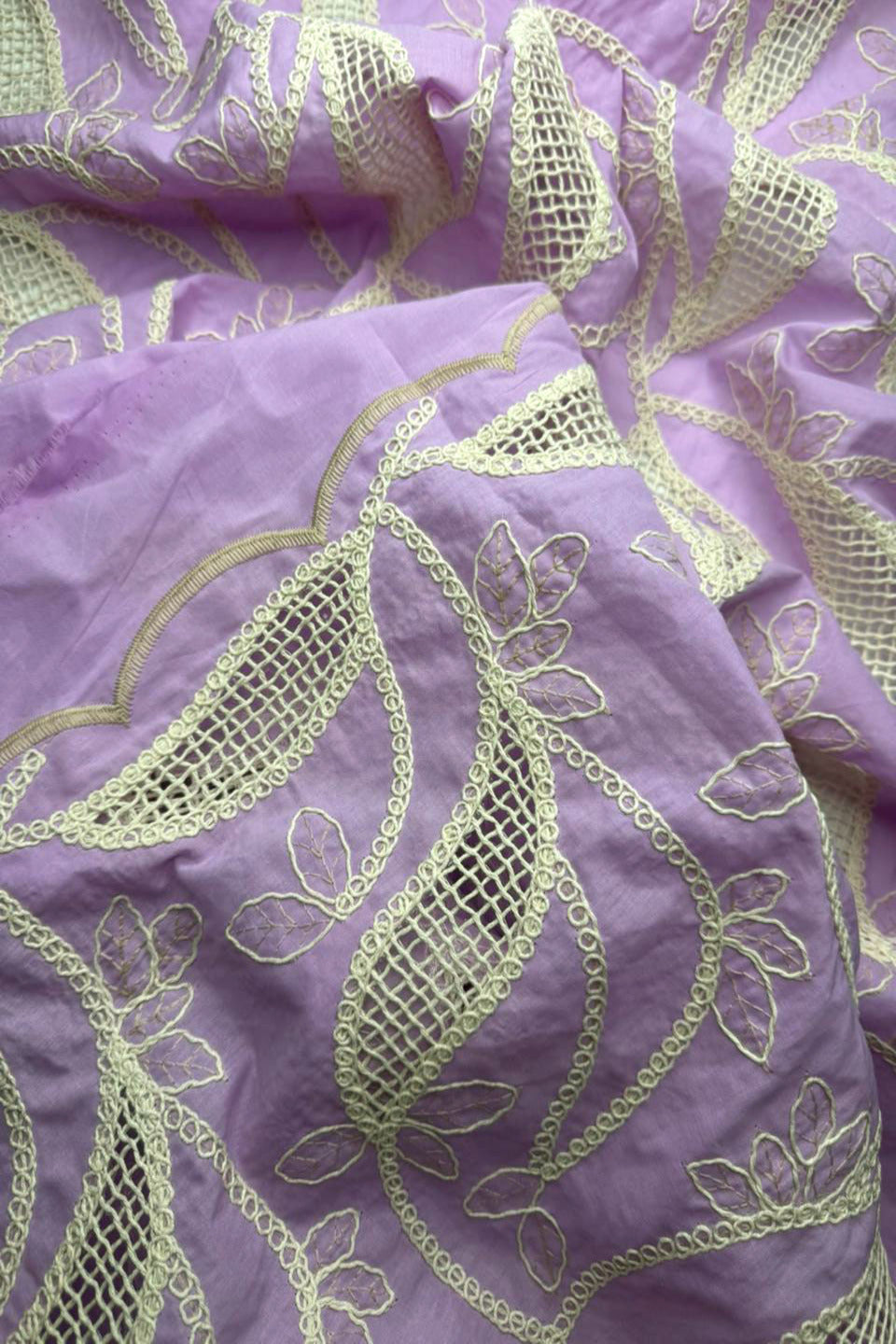Purple fabric with gold embroidery patterns
