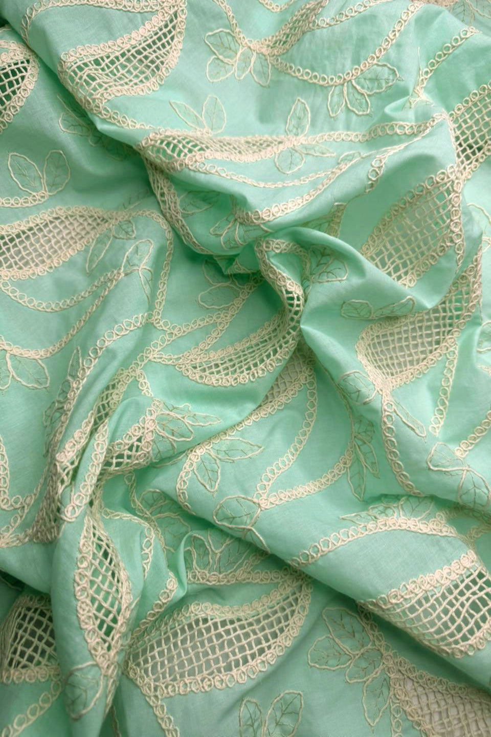 Mint green fabric with gold embroidery