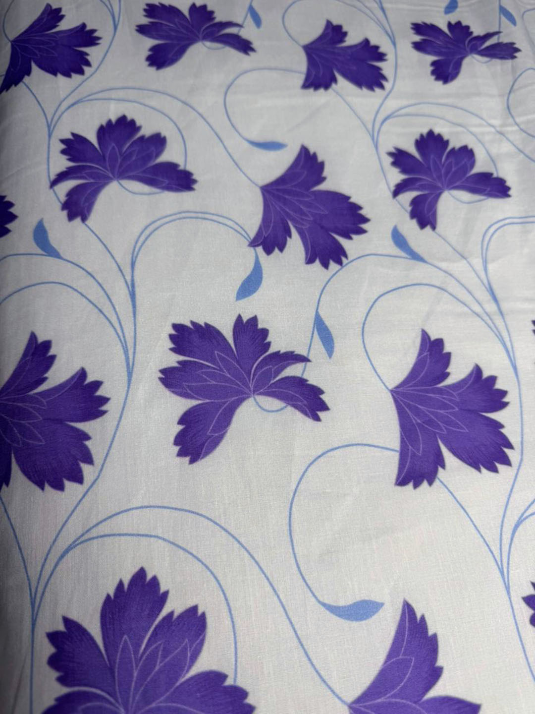 Floral pattern with purple flowers on a light gray background