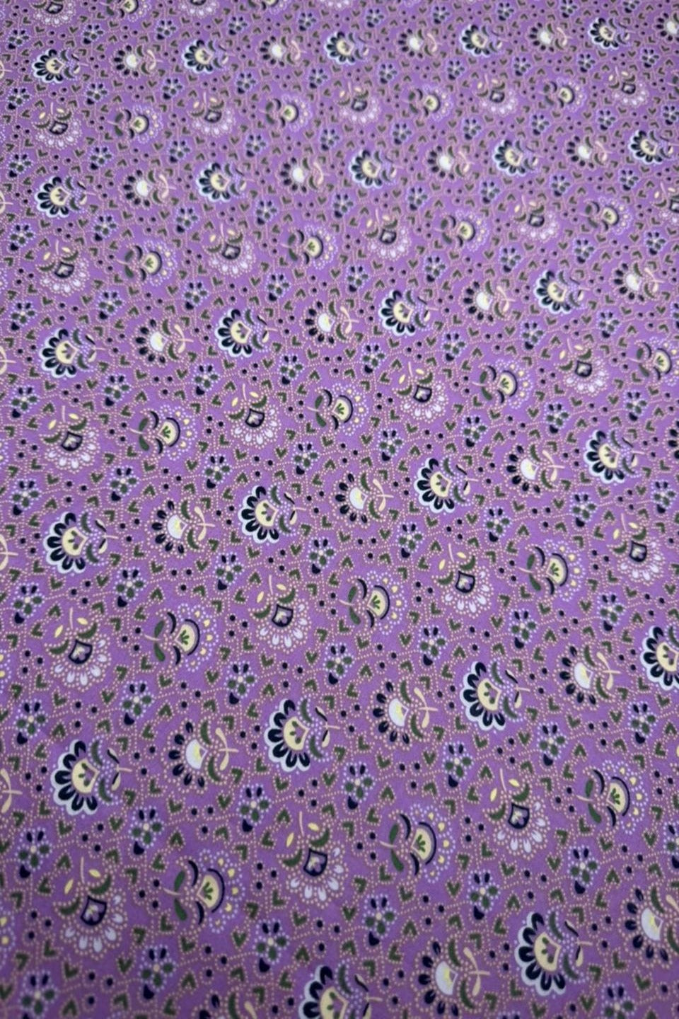 Purple fabric with small floral pattern