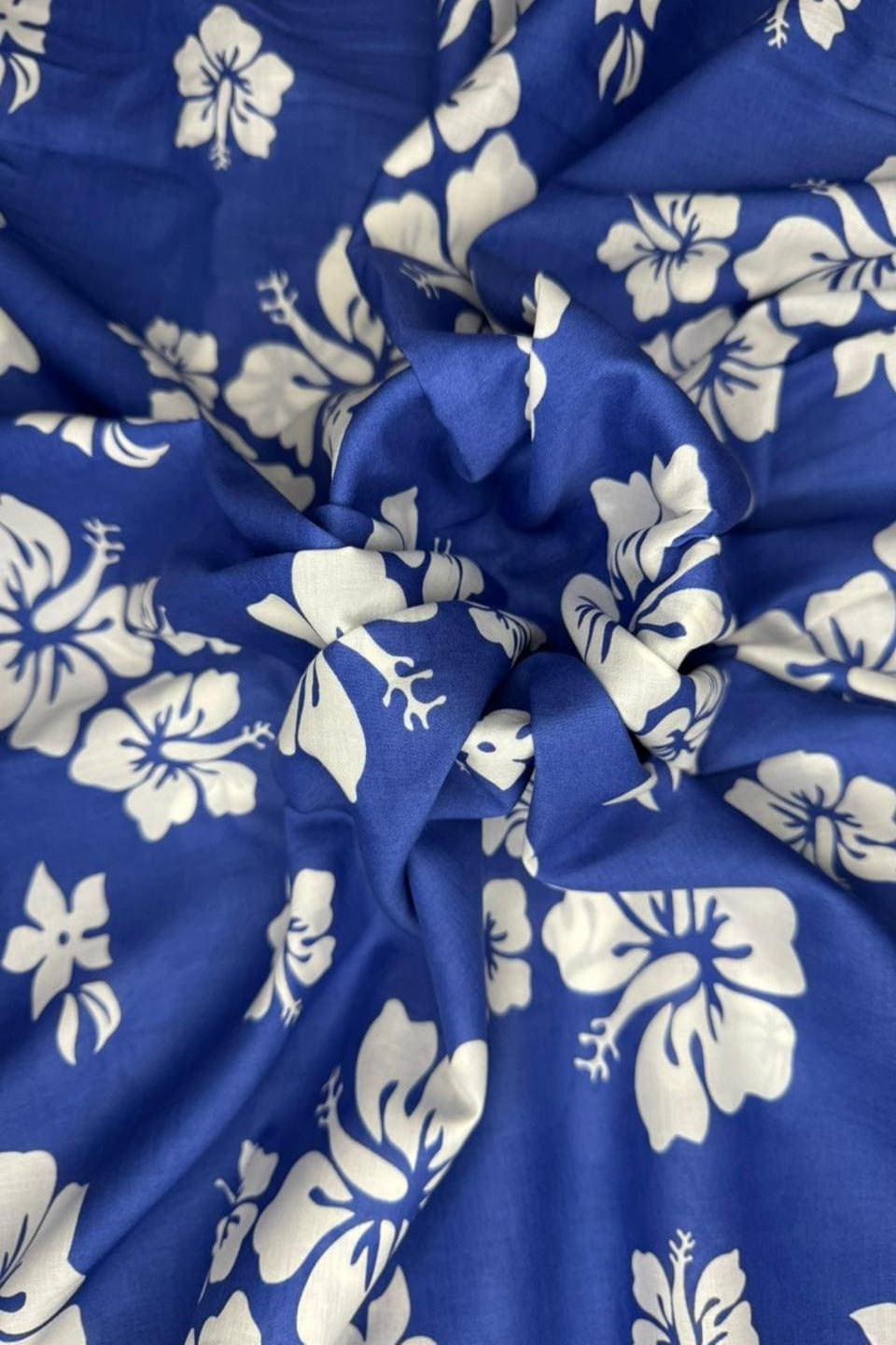 Blue fabric with white floral patterns