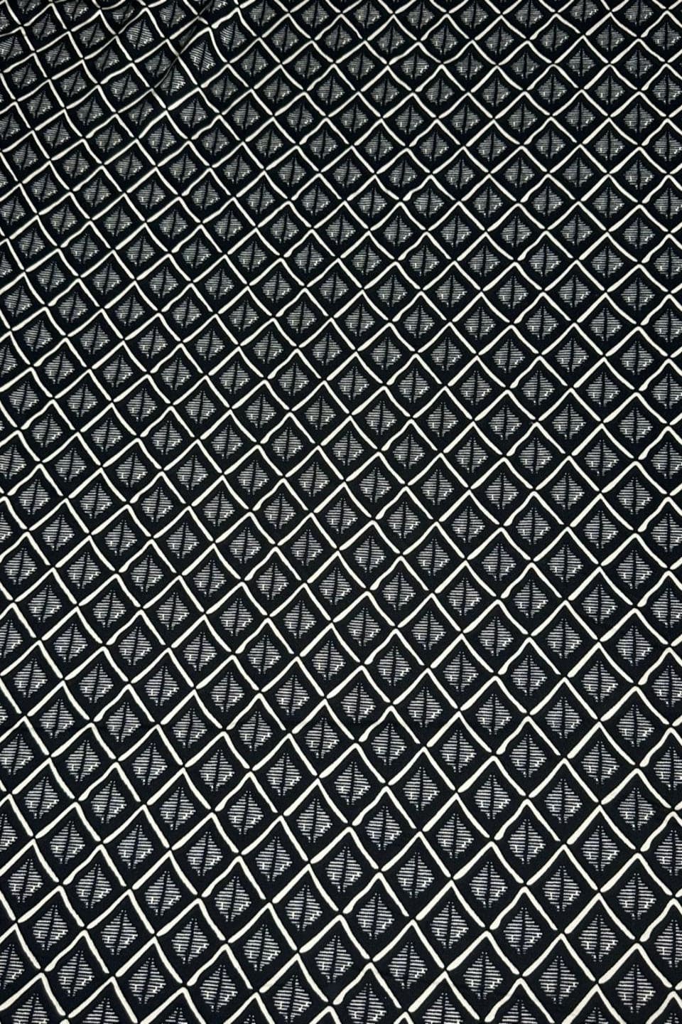 Black and white geometric pattern on a textured background