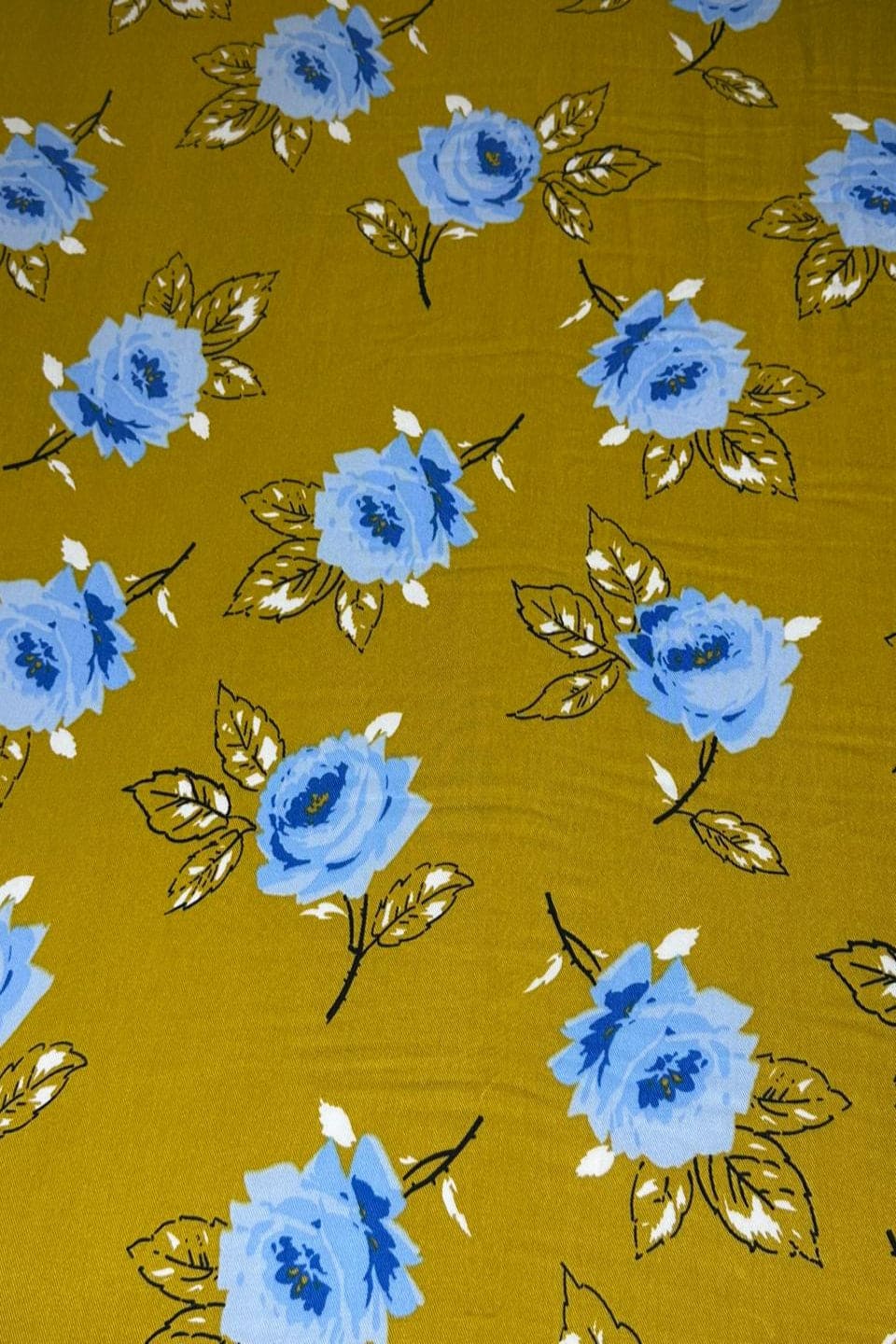 Pattern of blue flowers on a yellow background