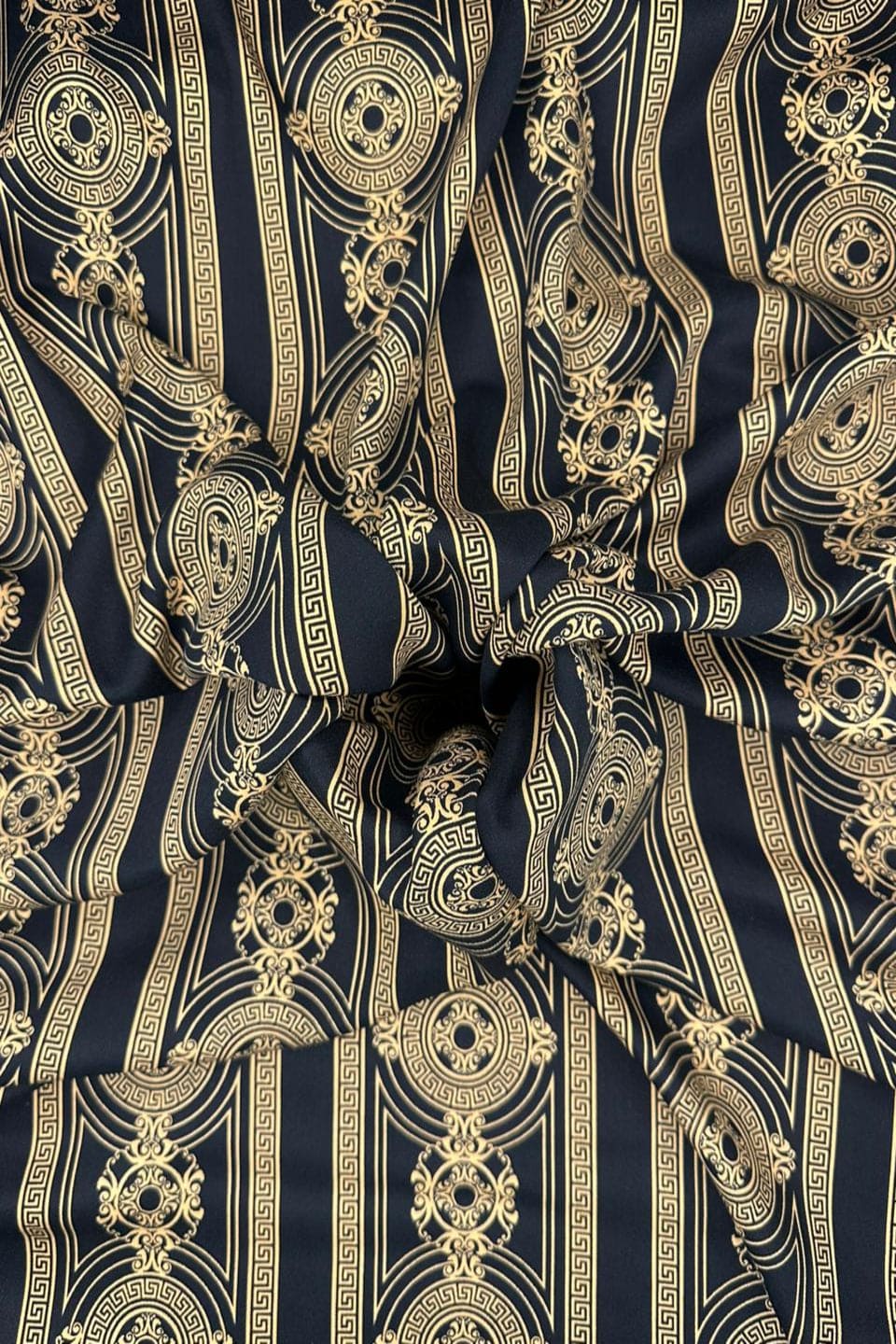 Patterned fabric with gold and black design