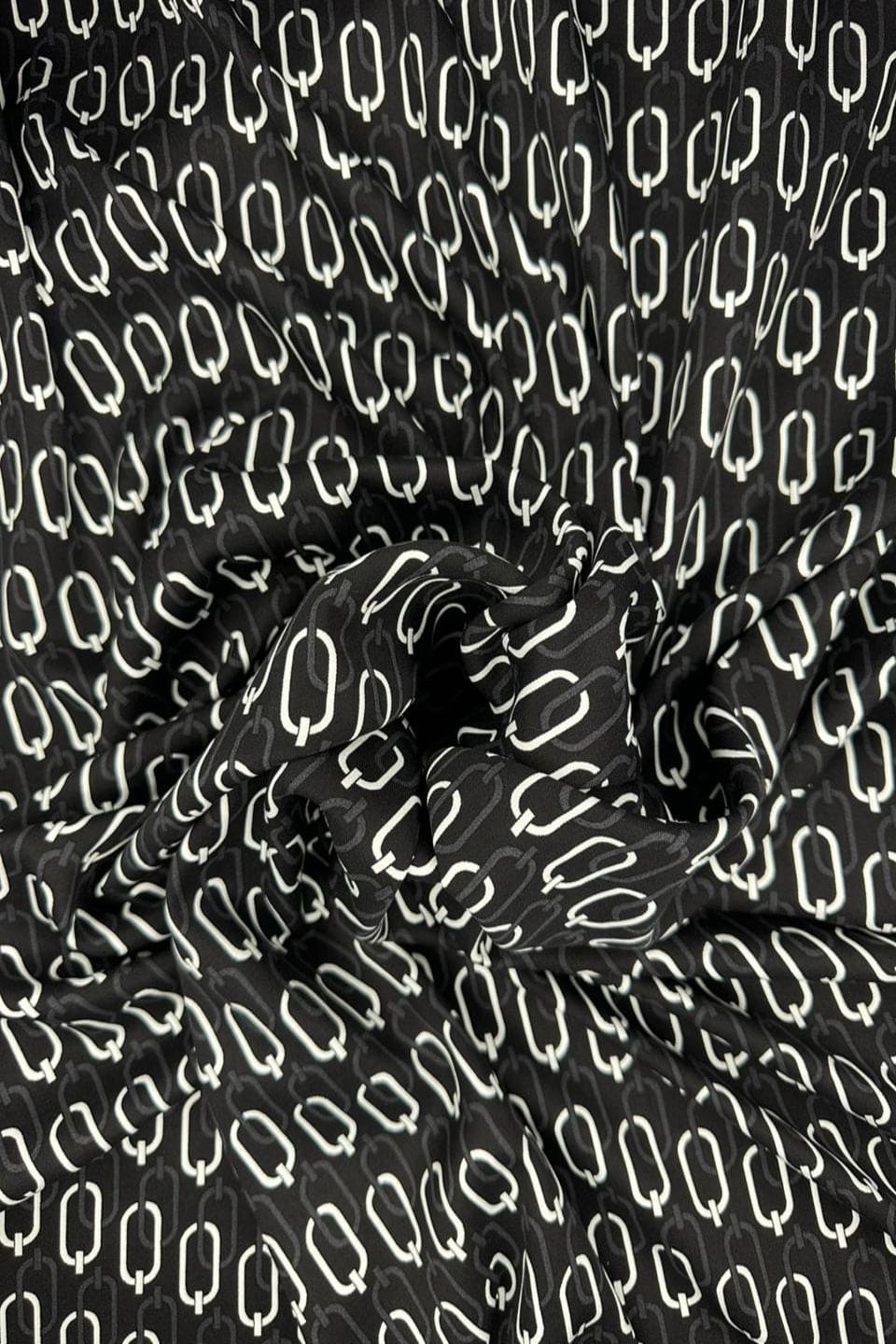 Black fabric with white abstract pattern