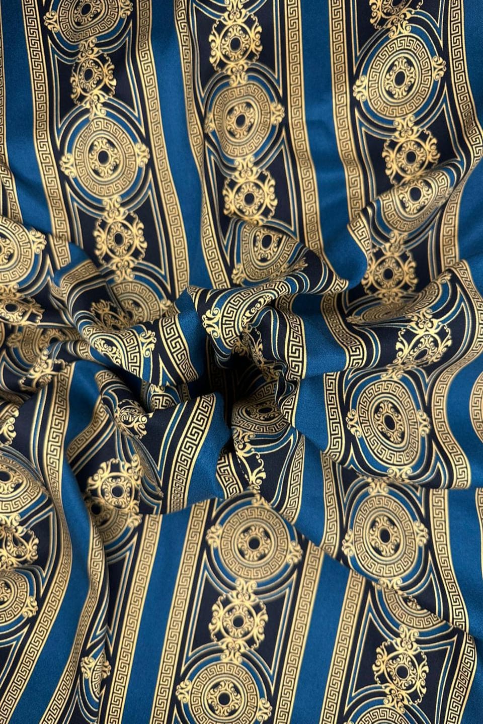 Close-up of blue and gold patterned fabric