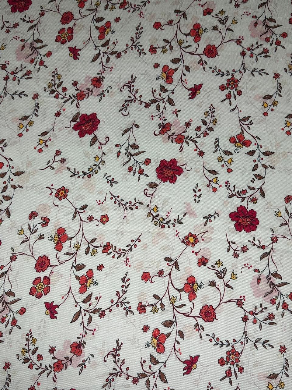 Floral fabric with red and pink flowers on a white background