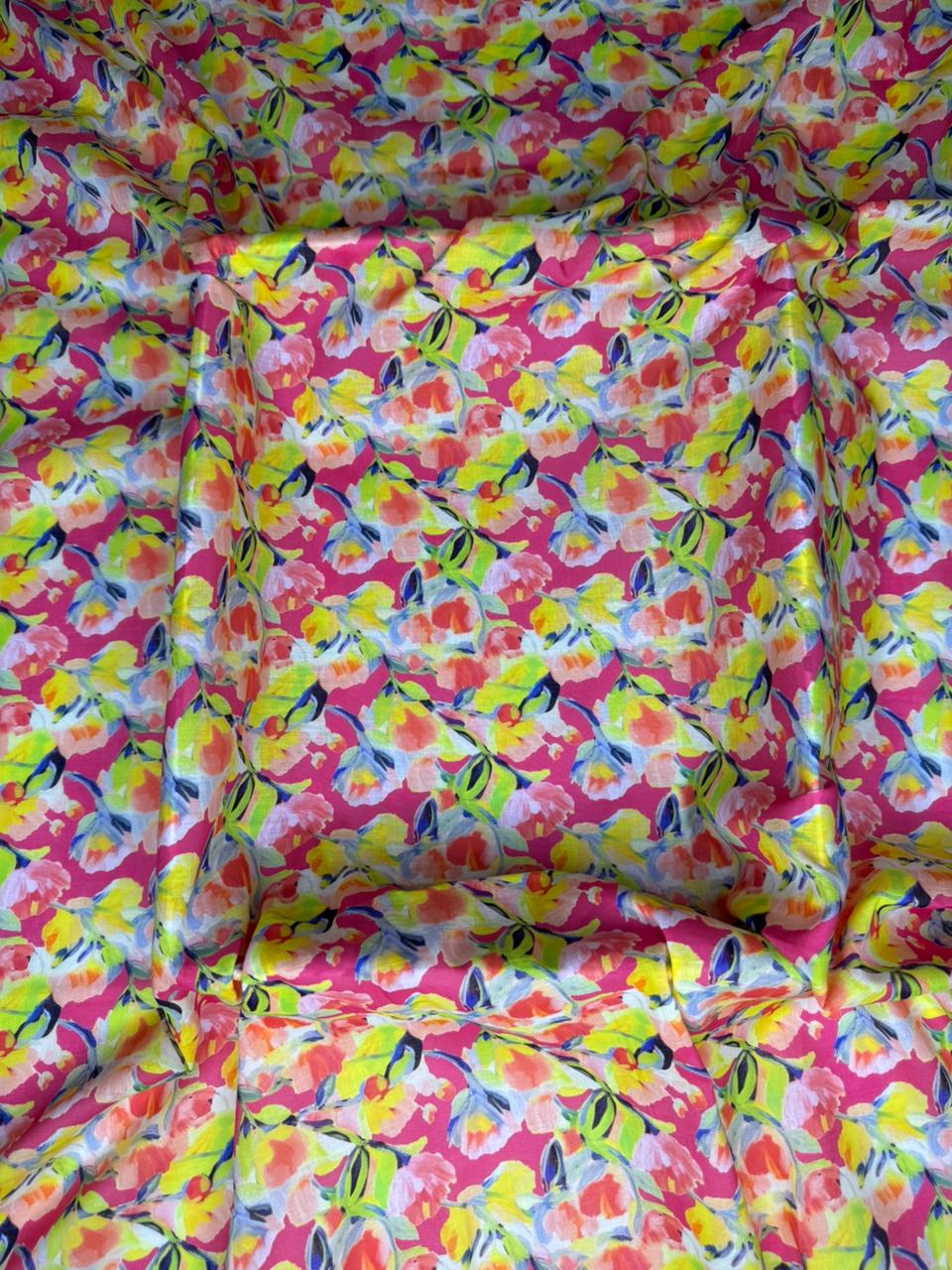 Colorful butterfly-patterned fabric with a pink background