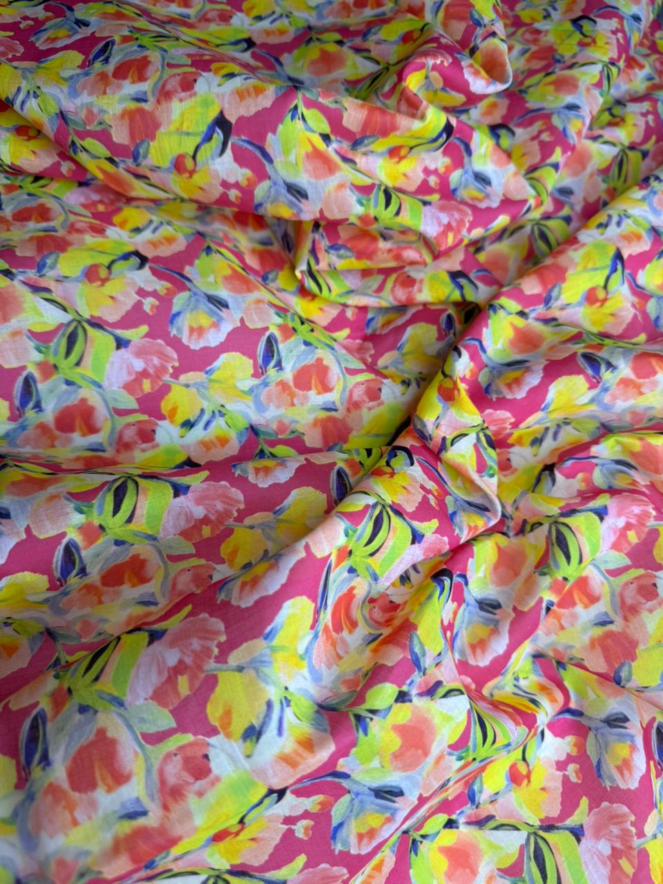 Colorful floral fabric with a pink background