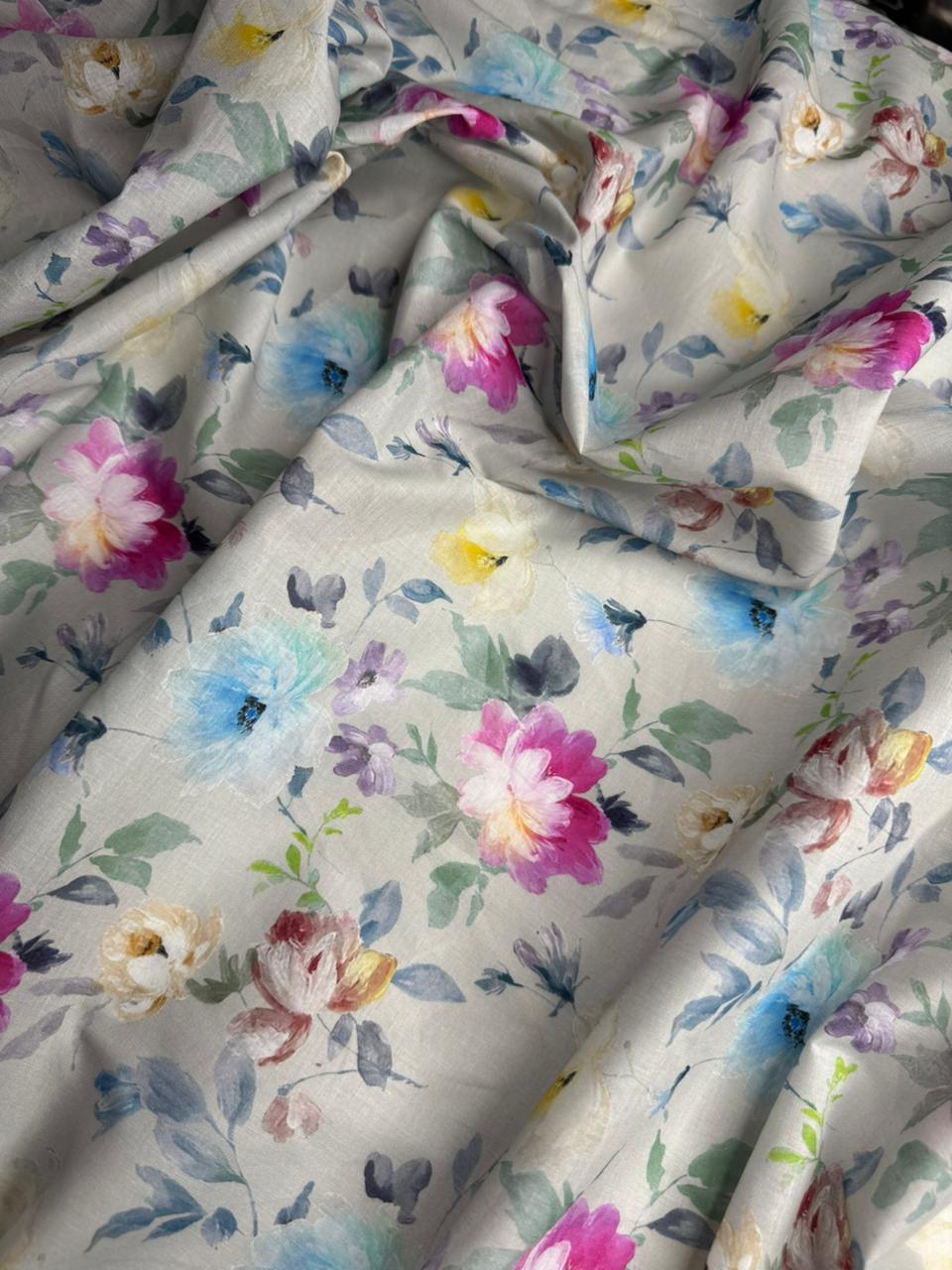 Floral patterned fabric with colorful flowers on a light background