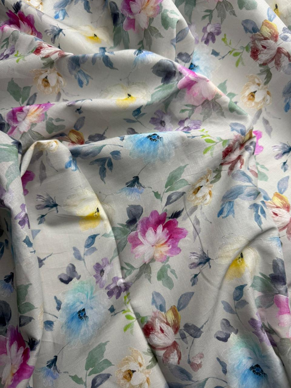 Floral fabric with colorful flowers and leaves on a white background