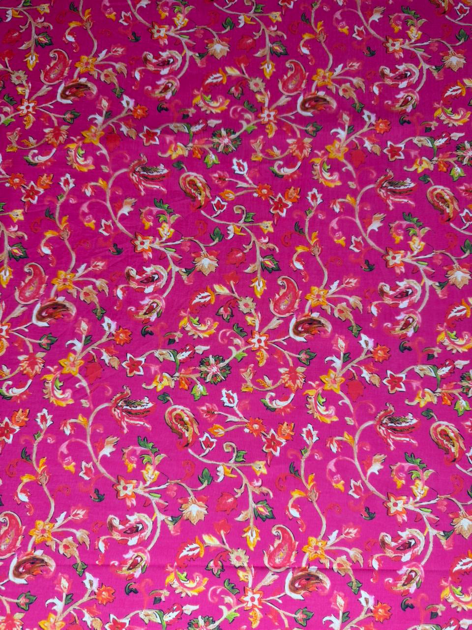 Floral patterned fabric on a pink background
