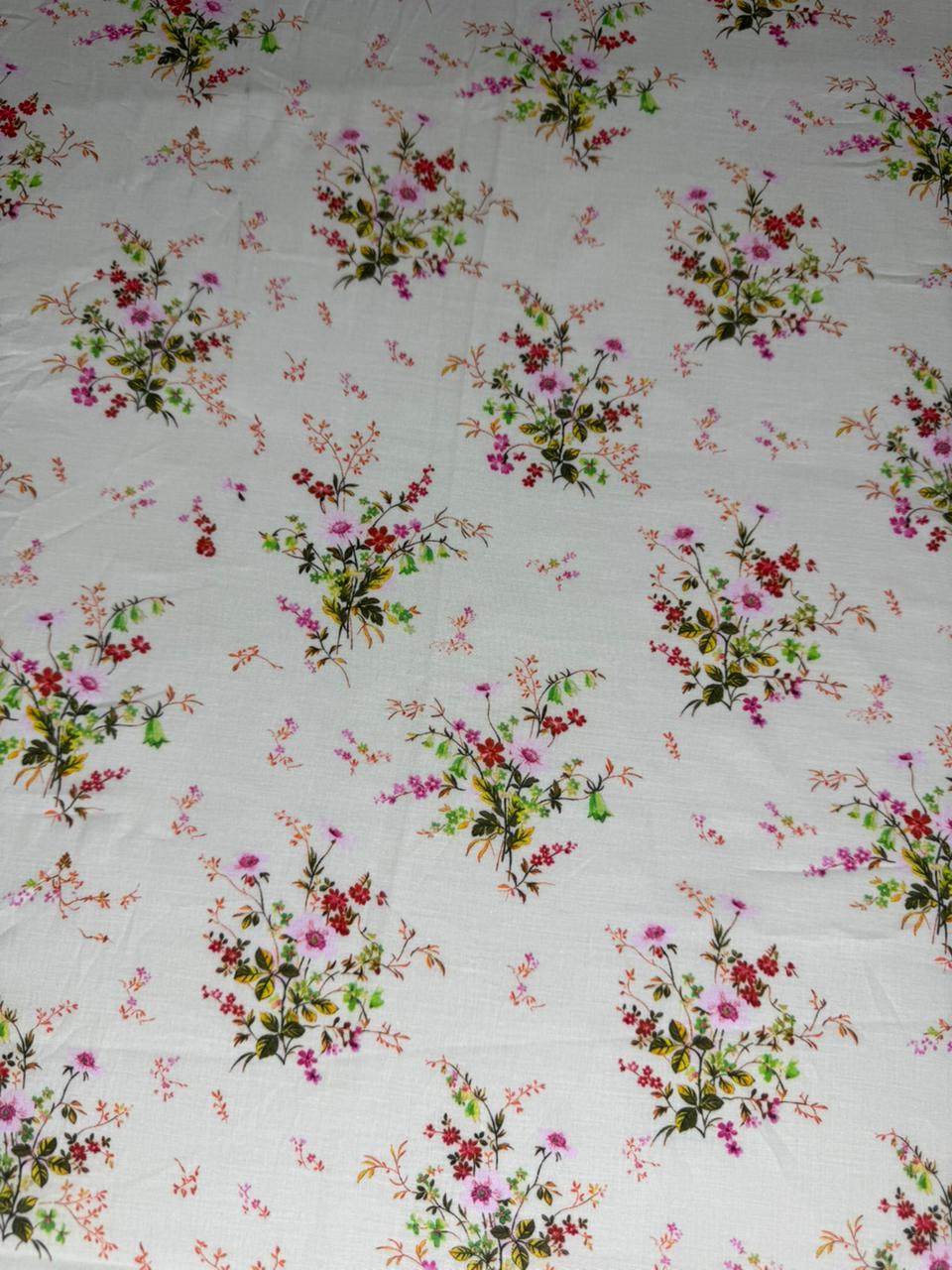 Floral patterned fabric with small flowers on a white background