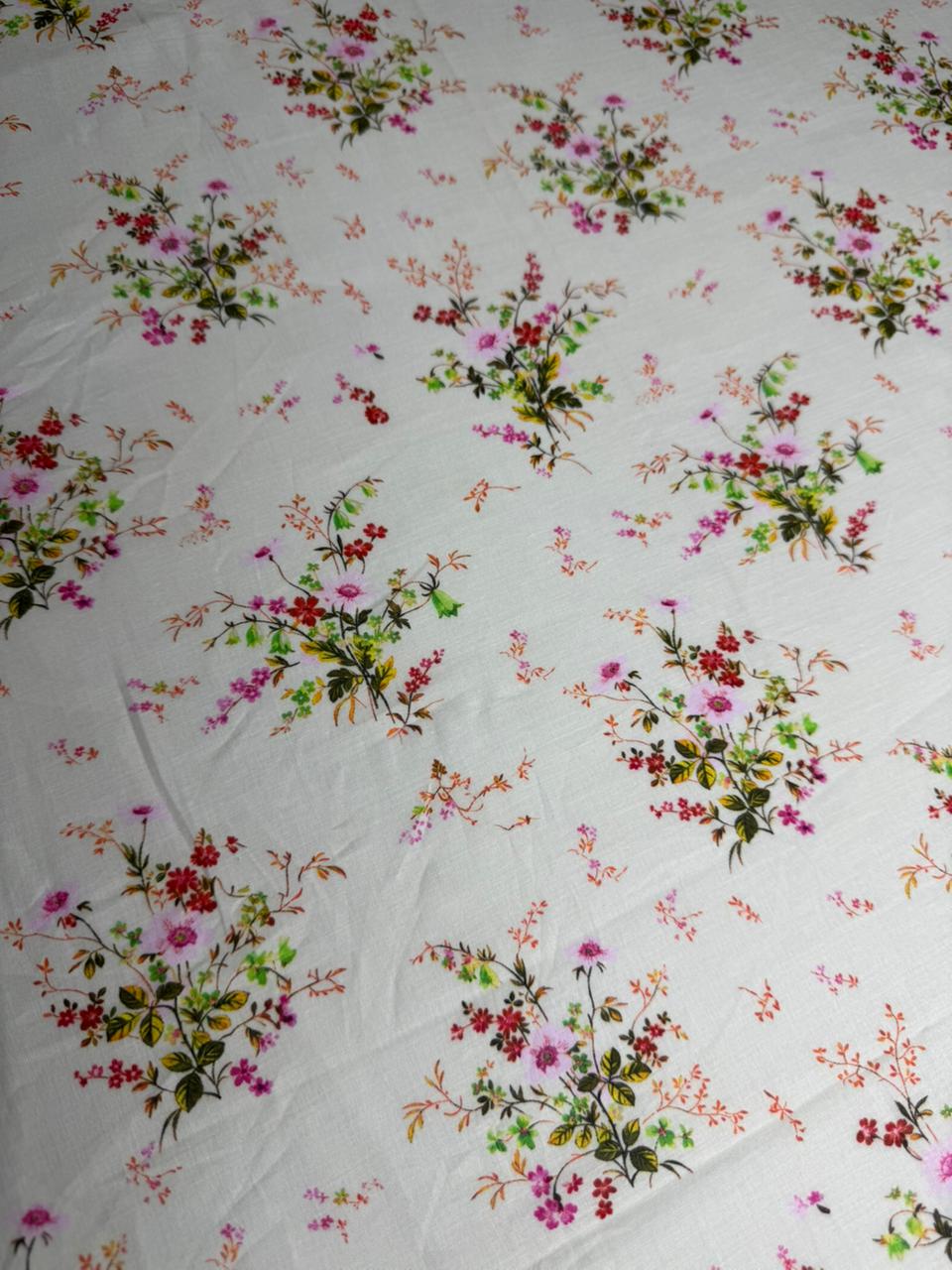 Floral patterned fabric with colorful flowers on a white background