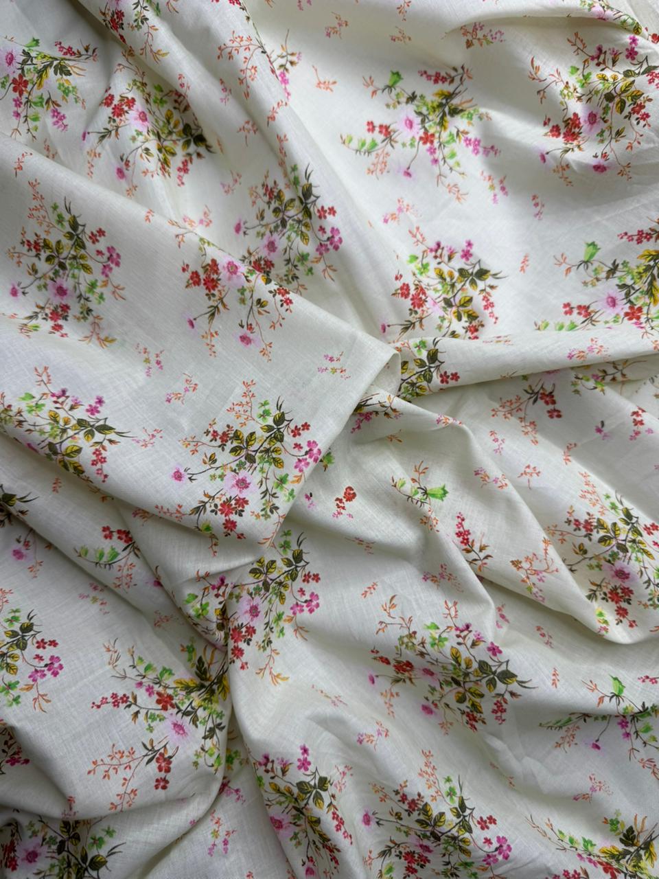 Floral patterned fabric with small flowers on a white background