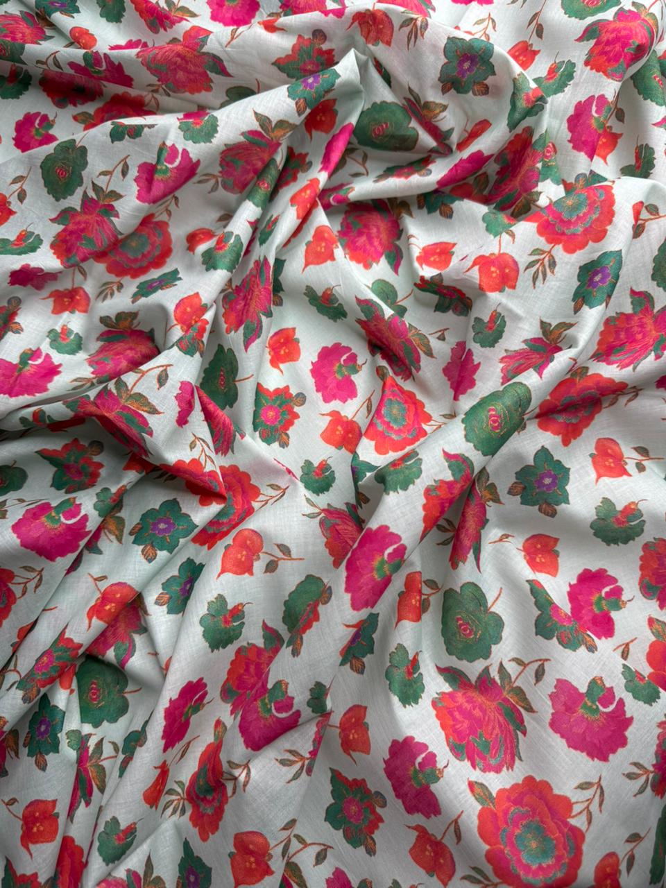 Floral fabric with pink and green flowers on a white background