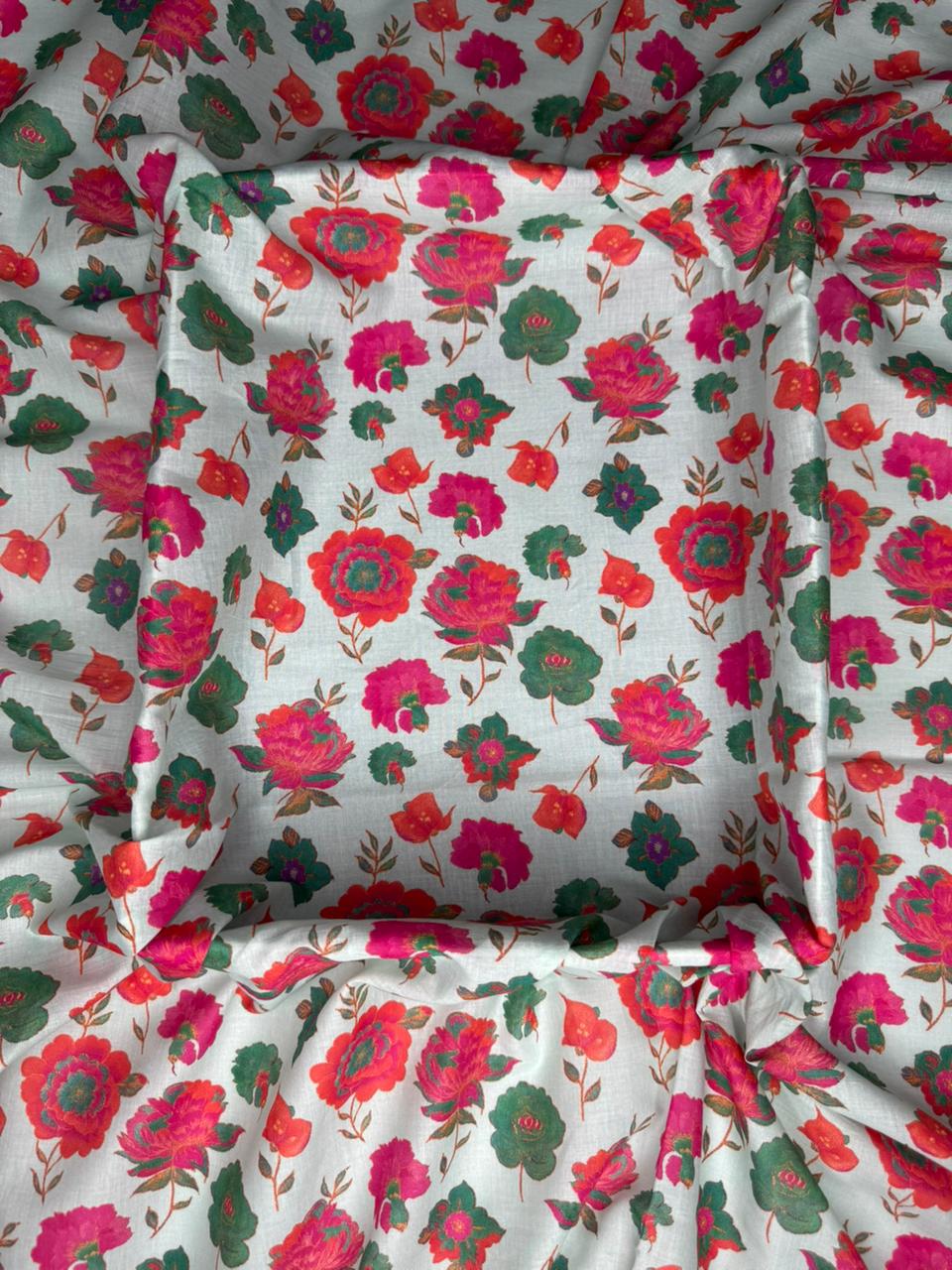 Floral fabric with red and green flowers on a white background
