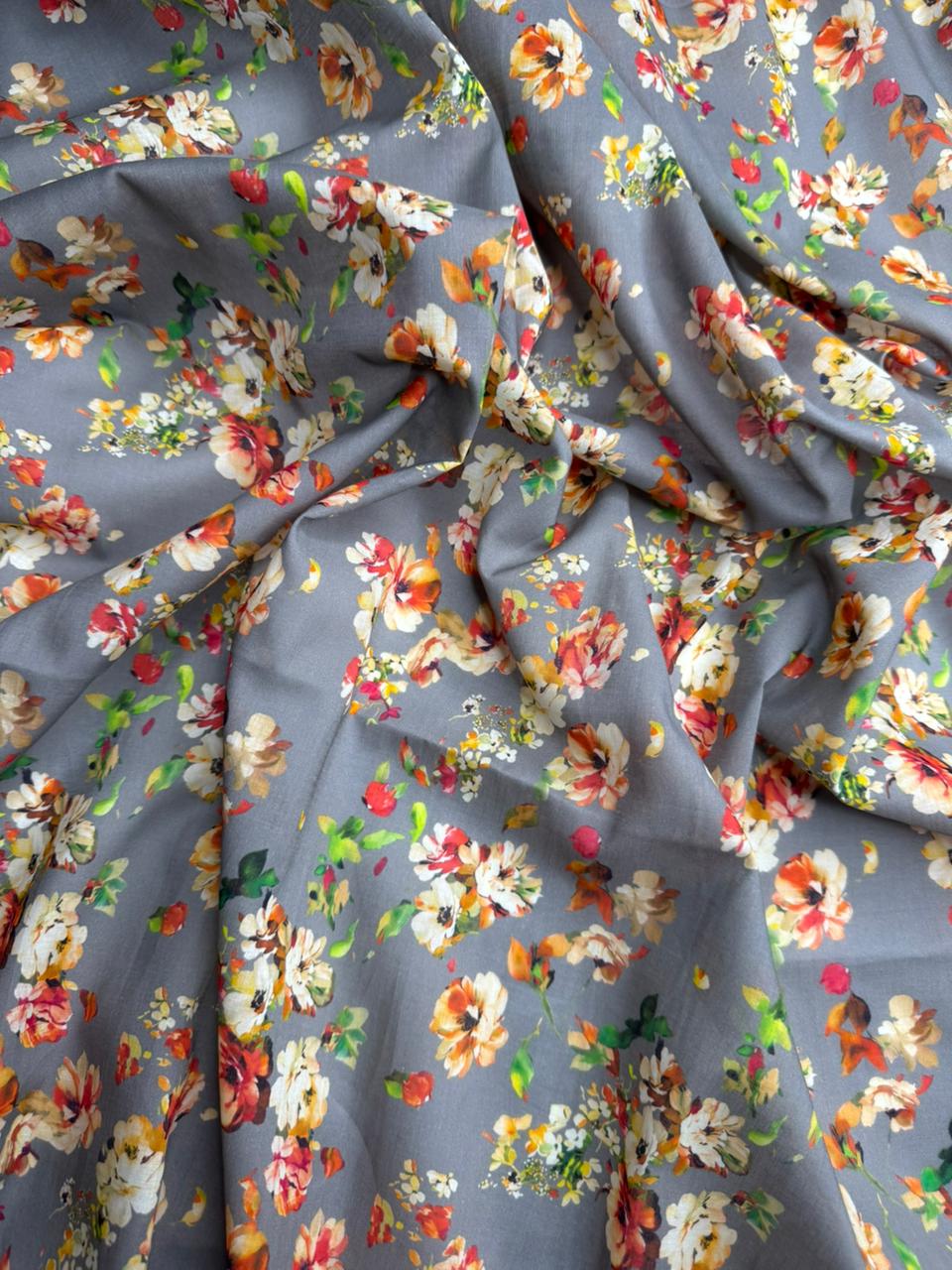 Floral fabric with colorful flowers on a gray background