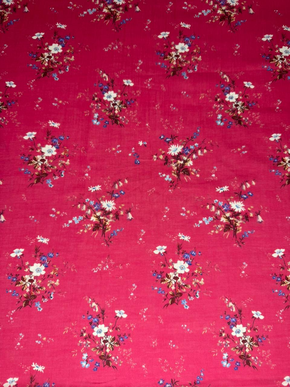 Floral pattern on a red fabric background