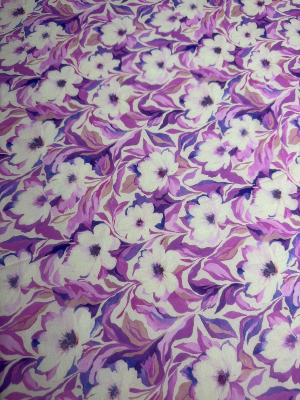 Floral pattern with white flowers and purple leaves on a fabric background