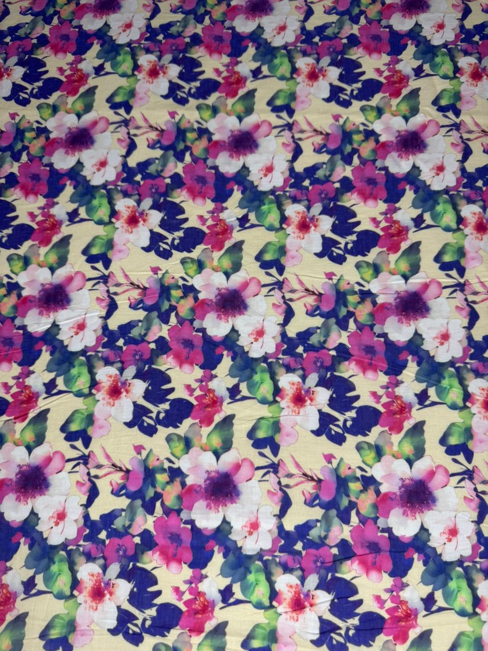 Floral fabric pattern with pink, purple, and green flowers on a beige background