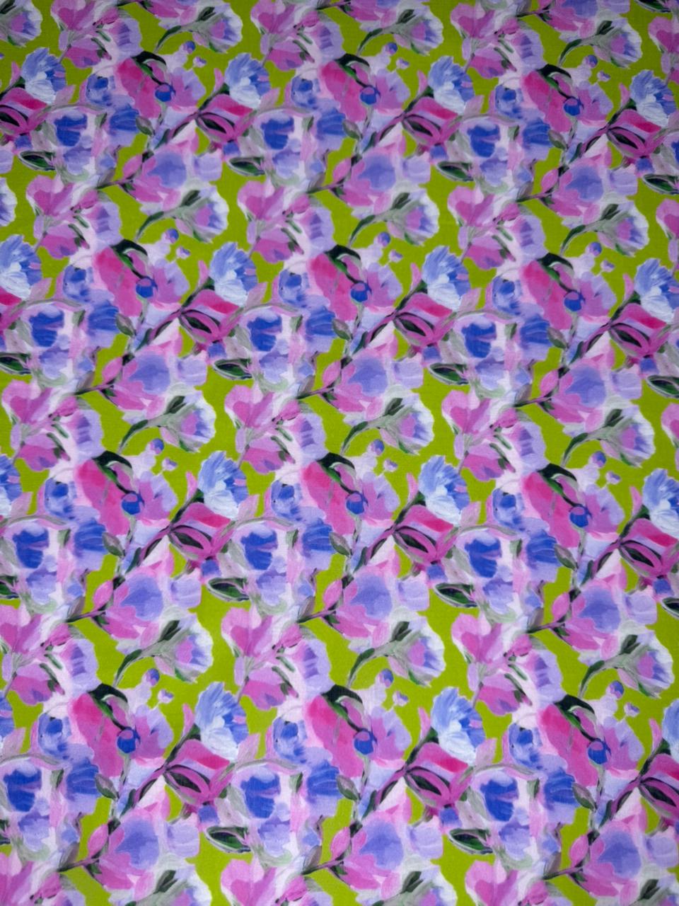 Pattern of pink and blue flowers on a green background