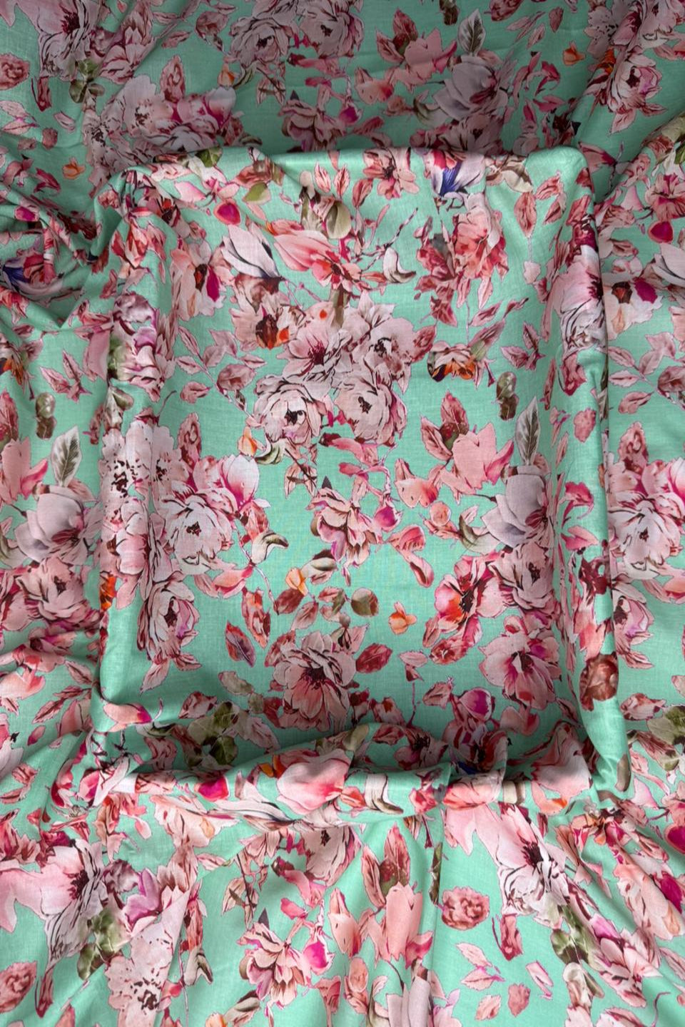 Floral patterned fabric with pink and green colors