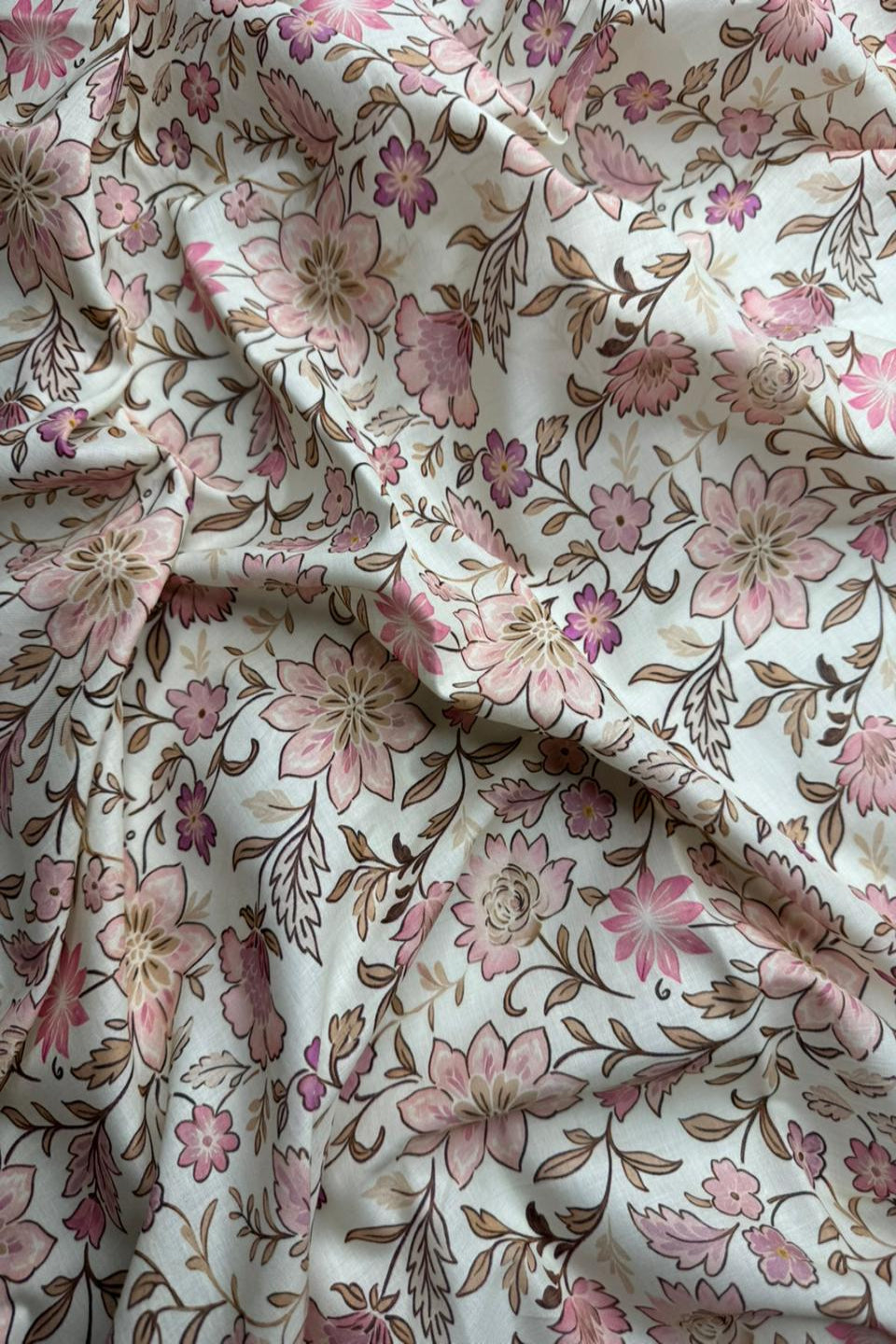 Floral fabric with pink and brown flowers on a white background