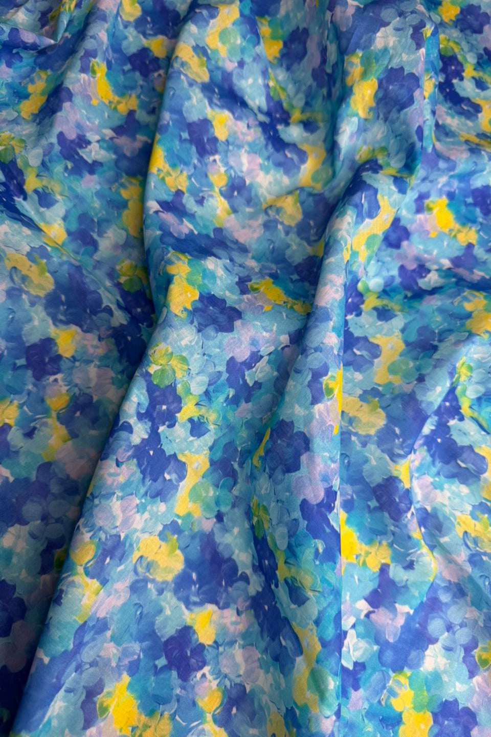 Multicolored fabric with blue, yellow, and purple pattern