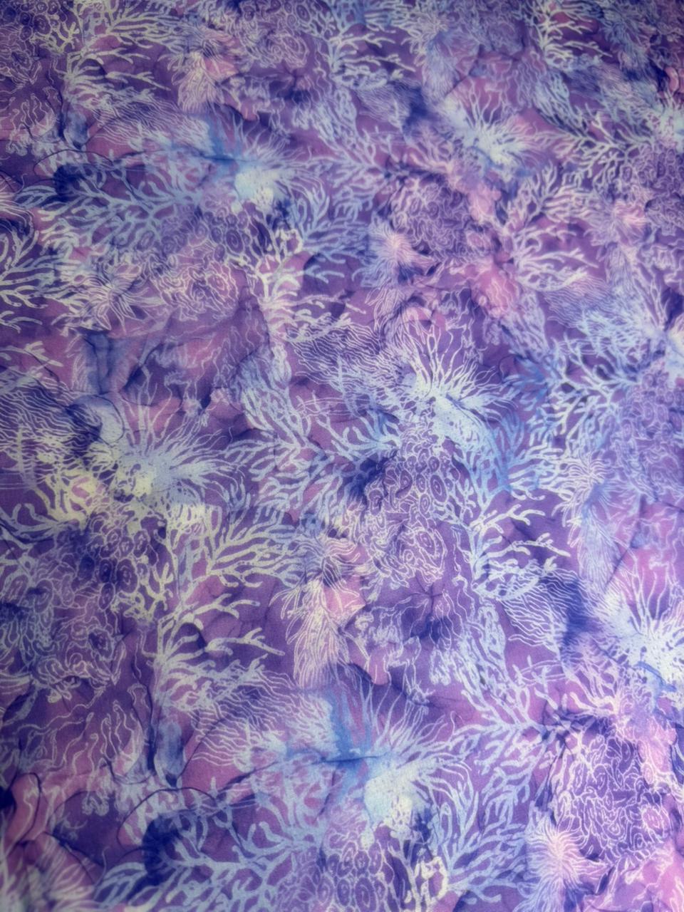 Fiberglass mesh with a floral pattern in purple, pink, and green.
