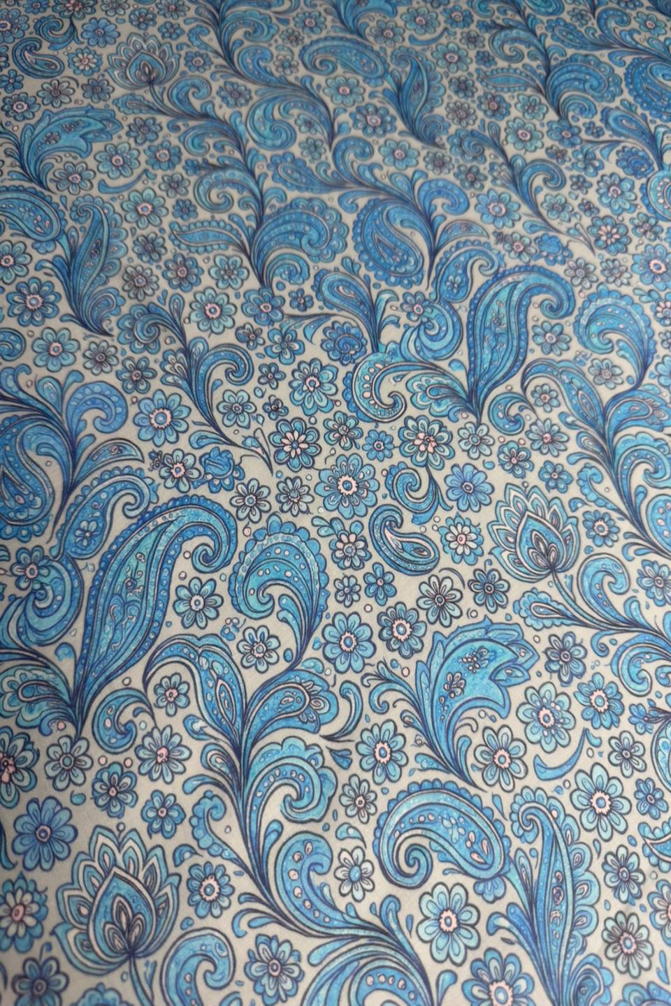 Blue and beige paisley patterned fabric