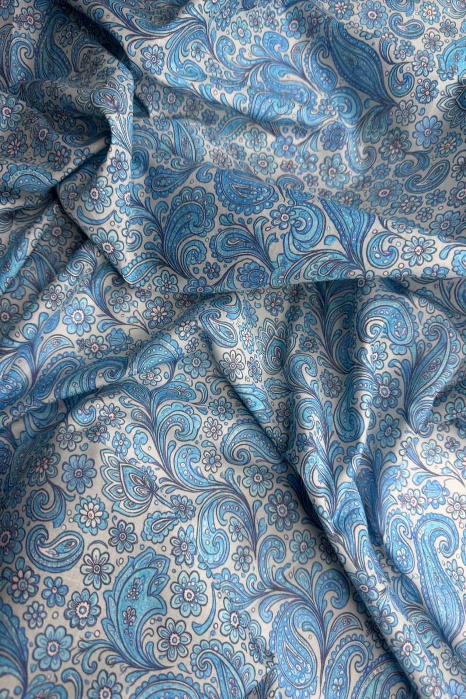 Blue and white paisley patterned fabric