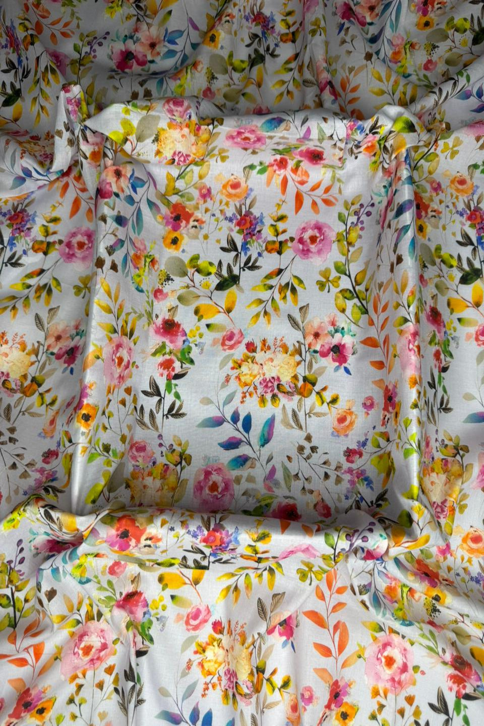 Floral patterned fabric with colorful flowers on a white background