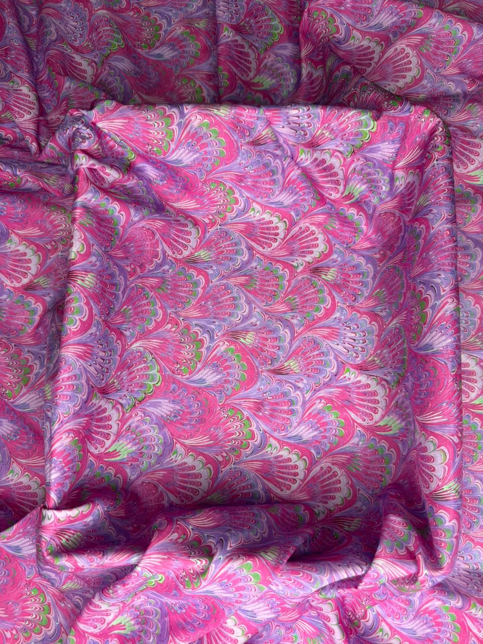 Pink and purple patterned fabric with floral design