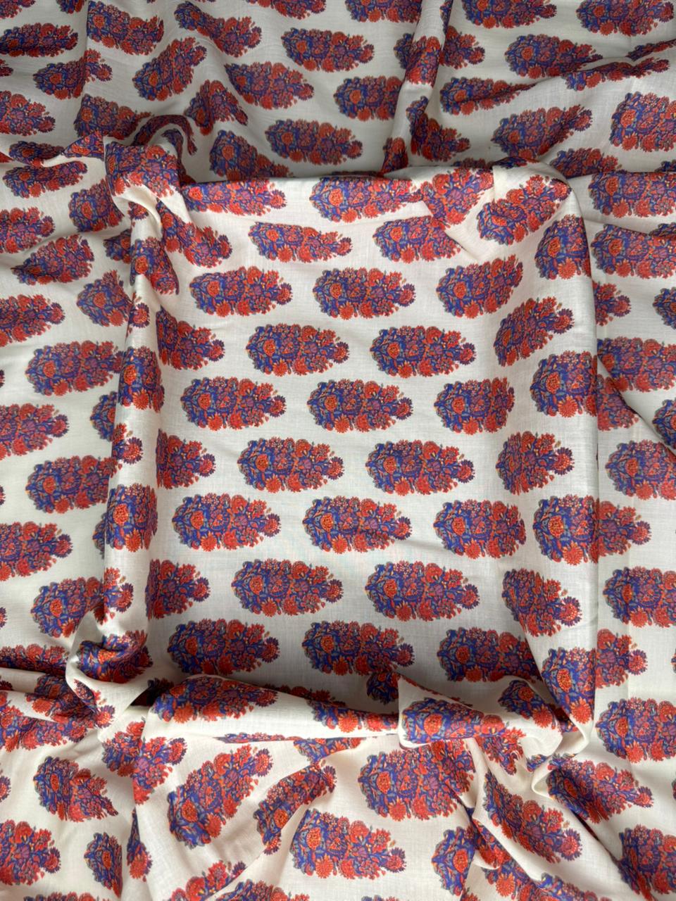 Floral patterned fabric with red and blue colors on a white background