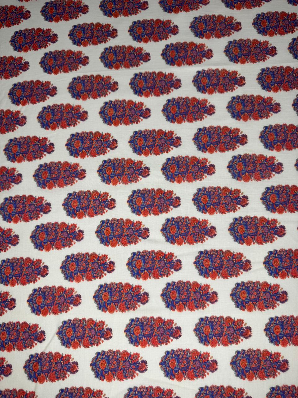 Patterned fabric with red and blue floral design on a white background