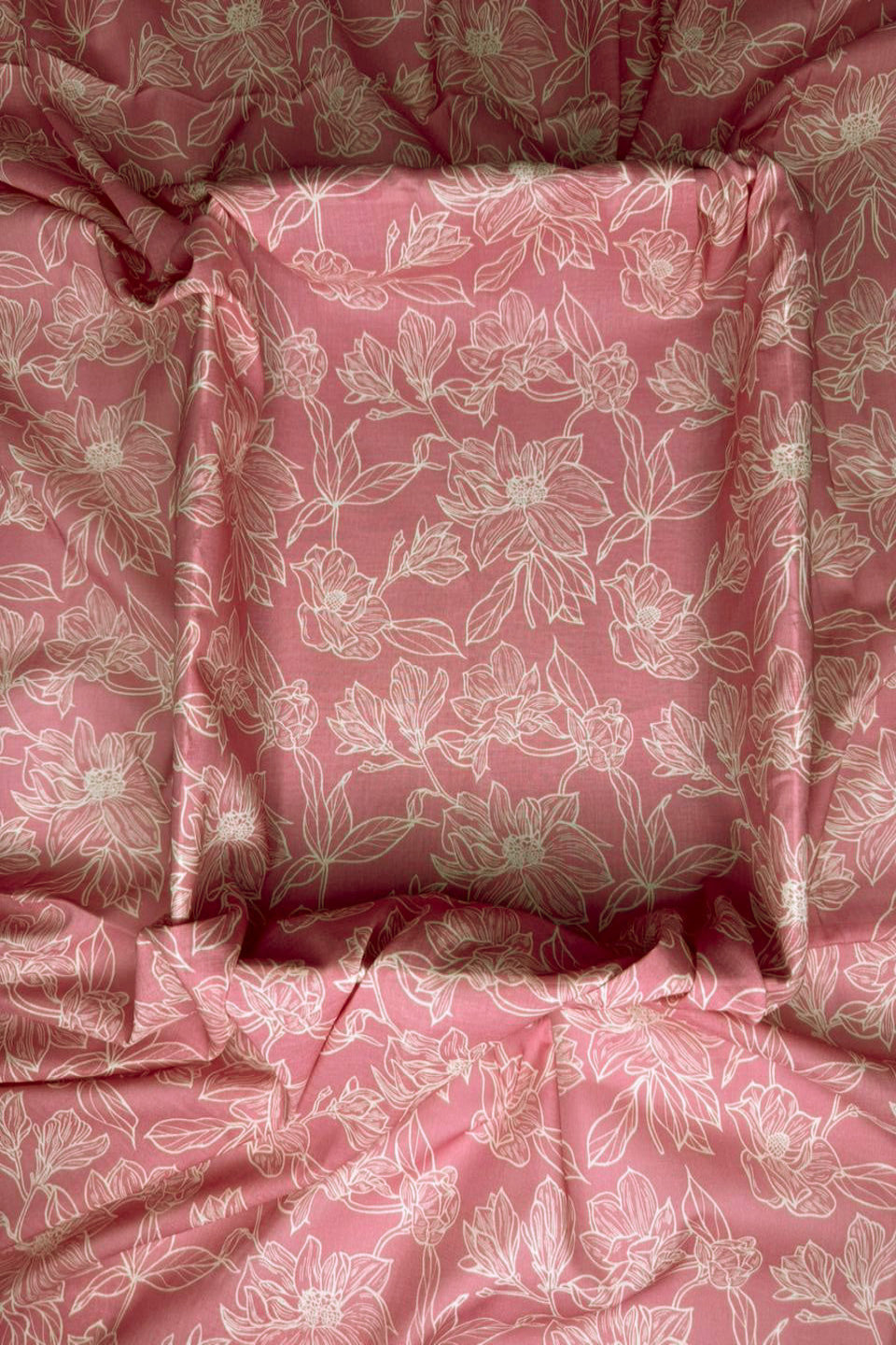 Pink floral fabric with a subtle pattern