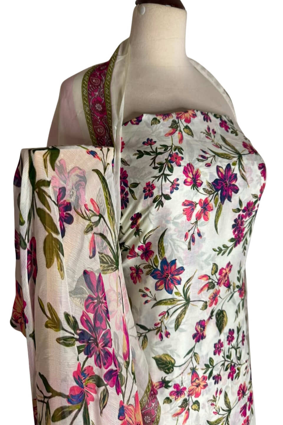 Floral patterned fabric on a mannequin with a white background