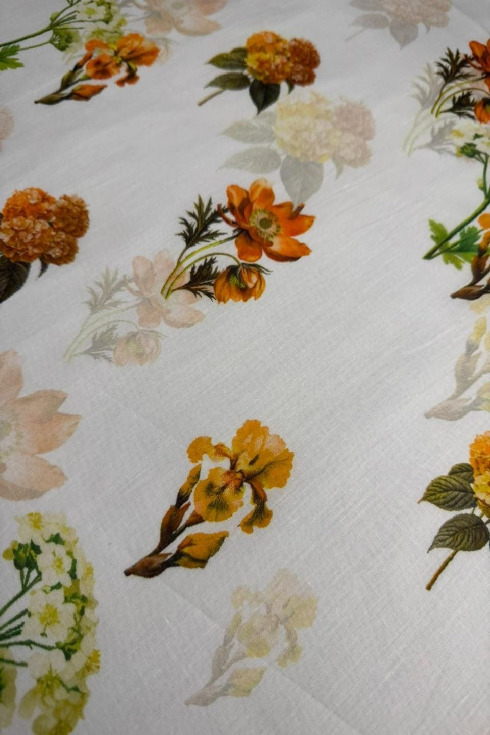 Floral pattern with orange and yellow flowers on a white background