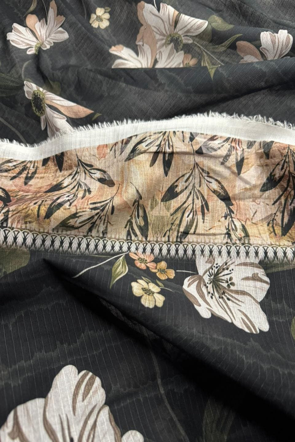 Close-up of floral fabric with a dark background