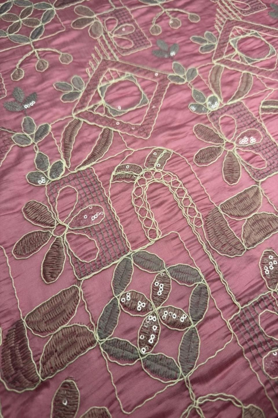 Pink fabric with floral embroidery and sequins